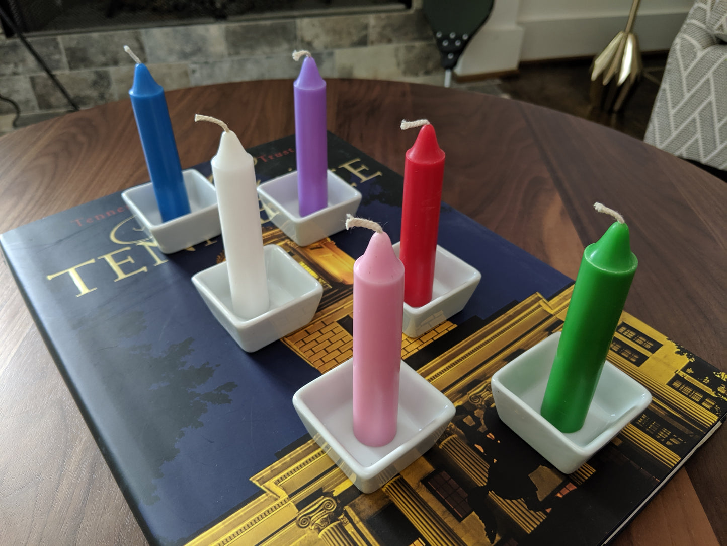 Close up image, multi colored candles displayed on coffee table.